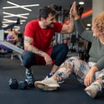 Personal Trainer supporting client in gym – understanding scope of practice and professional boundaries in the UK